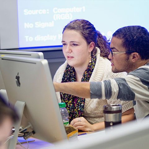 students working on computer